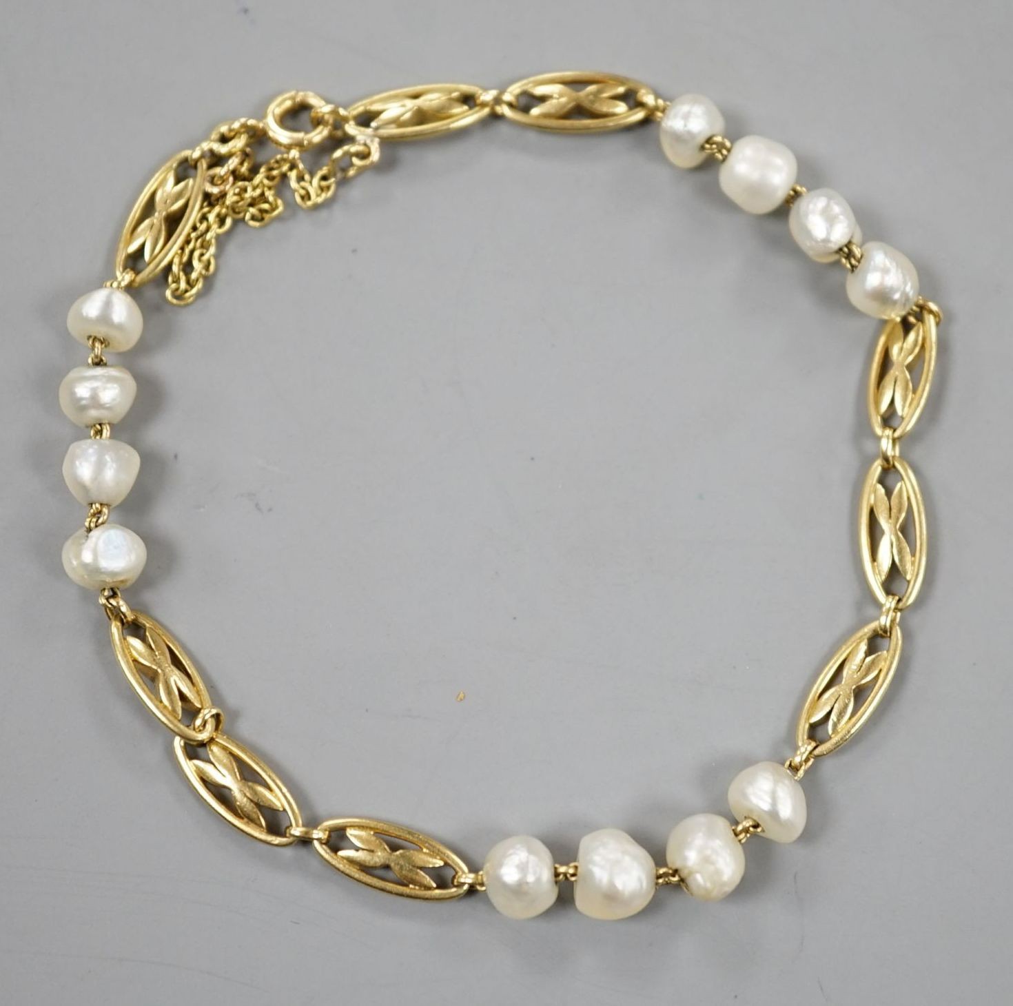 A yellow metal and baroque pearl set fancy link bracelet, 18cm